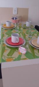 a table with plates and cups on top at San Jose Termas in Federación