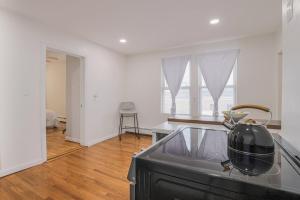 a kitchen with a sink and a pot on a stove at Cozy Room in the City of Worcester in Worcester