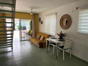 a living room with a couch and a table at Blue Lagoon Apartment in Lagun