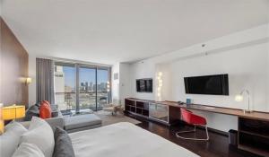 a hotel room with a bed and a tv at Justin's at Palms Place in Las Vegas