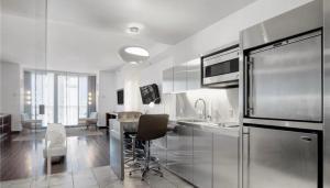 a kitchen with a table and a dining room at Justin's at Palms Place in Las Vegas