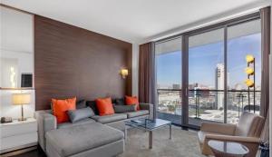 a living room with a couch and a large window at Justin's at Palms Place in Las Vegas