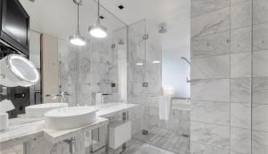a white bathroom with a sink and a shower at Justin's at Palms Place in Las Vegas +13 photos