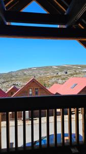 a view from the balcony of a house at Memórias da Serra - Chalé Serra da Estrela Penhas da Saude in Penhas da Saúde