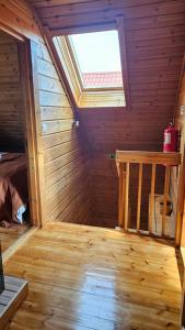 an inside view of a wooden room with a window at Memórias da Serra - Chalé Serra da Estrela Penhas da Saude in Penhas da Saúde