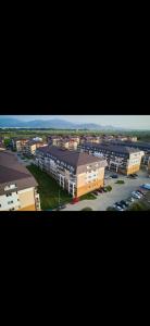 an overhead view of a city with buildings and a parking lot at Fantastic Cozy Studio in Sînpetru