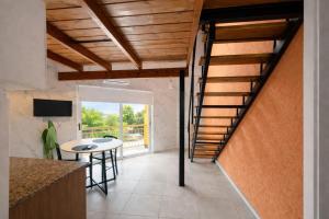 a kitchen with a spiral staircase in a house at Ana rent Ballester departamentos modernos luminosos, equipados para una hermosa estadia in Villa Ballester