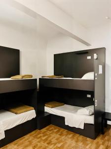 a room with three bunk beds in it at Beauty Holidays in Rome