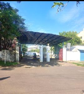 a gas station with a roof over a road at Lorenas Tuffoam mall Apartment in Kisumu +3 photos