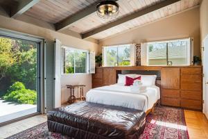 a bedroom with a bed and a large window at Spacious 4BR Backyard Oasis with BBQ Near UC Davis in Davis
