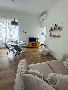 a living room with a couch and a table at Blu Bolivar in Marina di Camerota