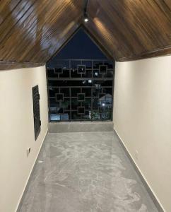 an empty room with a view of a wine cellar at LKL appartements in Kinshasa