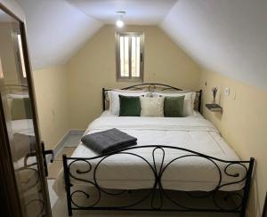 a bedroom with a large bed in a attic at LKL appartements in Kinshasa