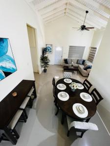 a living room with a table and chairs and a couch at Escape Beloved in Florence Hall