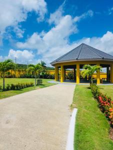 a pavilion in a park with a pathway at Escape Beloved in Florence Hall