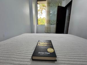a book sitting on top of a bed at Puyo River Room in Puyo +40 photos