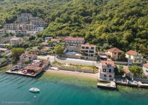 an aerial view of a small town on the water at Seafront Villa with Private Pool & Beach in Kotor Bay, Villa Viborg in Kotor +36 photos