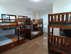 a group of bunk beds in a room at Michaels Spring Resort, Natural Hot Spring in Calamba