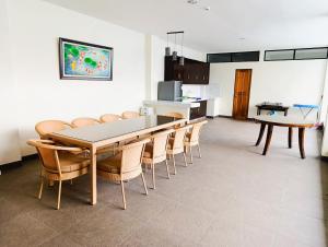 a kitchen and dining room with a table and chairs at Michaels Spring Resort, Natural Hot Spring in Calamba