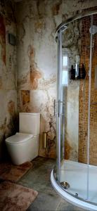 a bathroom with a shower and a toilet and a tub at Dabbagh Residence in Lees +7 photos