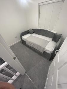 a small bedroom with a bed and a window at blackburn home in Blackburn +2 photos