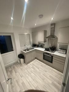 a kitchen with a sink and a stove at blackburn home in Blackburn