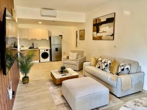 a living room with a couch and a table at Punta Cana Retreat in Punta Cana