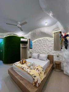 a bedroom with a bed in the middle of it at Amed Sea Resort in Amed +155 photos