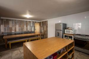 a kitchen with a counter top and a refrigerator at Hotel Kéri Inn in Guadalajara