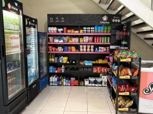 a store aisle of a grocery store with food at Praia Litorânea in São Luís