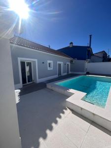 a swimming pool in the backyard of a house at Casas Morgado in Valada