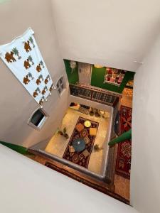 an overhead view of a living room with animals on the wall at Hotel & Riad Celia in Marrakesh