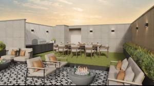 a rooftop patio with a table and chairs at Warm & Exclusive 2 BR in San Antonio