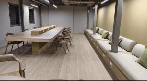 a conference room with a long table and chairs at Exclusive Rodadero Sur Studio Apartment in Santa Marta +18 photos