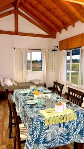 a dining room table with a blue and white table cloth at Quinta La Carlota in Navarro