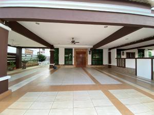 an empty lobby of a building with a ceiling at Ruma Relaxz by Jeffery Lam Home Management in Malacca +123 photos