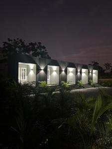 a house with lights on it at night at Apartaments in Sandy Bay in Sandy Bay