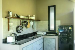 a kitchen with a sink and a counter top at CocoCool Villas in Hinkong