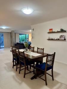a dining room with a table and chairs at Wandju Villa in Geographe