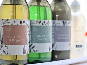 three bottles of wine sitting on a shelf at ホテルラフィネ in Toyonaka