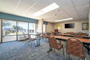 a conference room with tables and chairs and a tv at Hampton Inn by Hilton Spring Hill in Timber Pines +122 photos