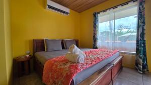 a bedroom with a bed with a towel on it at Rústicas Dani & Fam in Fortuna +36 photos
