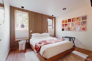 a bedroom with a large bed and a window at Camp Alpine in Packwood