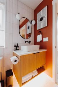 a bathroom with a sink and a mirror at Camp Alpine in Packwood +24 photos