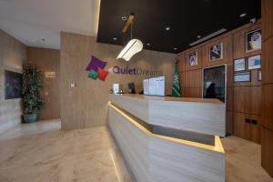 a lobby of an office with a reception counter at Quiet Dreams - Serviced Apartments King abdul Aziz Street Branch in Jeddah