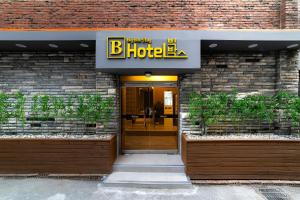 an entrance to a hotel with a sign on it at BigBoxStay Myeongdong in Seoul