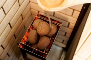 a bunch of eggs in a basket on a wall at Kiyomizu Elite Terrace in Kyoto