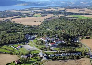 an aerial view of a resort with trees and a lake at Hedmarktoppen in Hamar