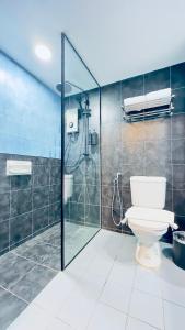 a bathroom with a toilet and a shower at Trigo Hotel Kuala Lumpur in Kuala Lumpur +18 photos