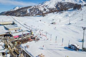 an aerial view of a ski resort in the snow at Appartamento Alpine Suite - Happy Rentals in Sestriere